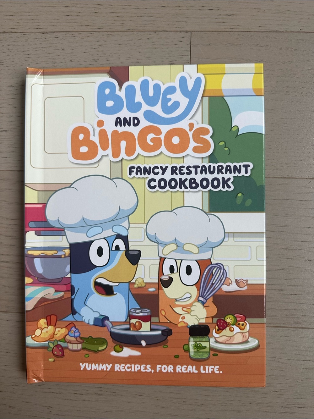 Bluey and Bingo's Fancy Restaurant Cookbook - Kids Cookbook in Blue & Orange